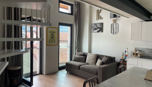 Open-plan loft overlooking Lake Como with private parking space in Malgrate